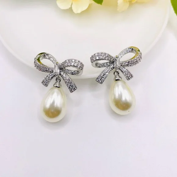 Anthro Shashi Pave Pearl Bow Earrings - Picture 2 of 6